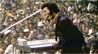  ?? Searchligh­t Pictures ?? NINA SIMONE, top, and Sly and the Family Stone were among the acts at the six-week Harlem Cultural Festival in 1969 whose performanc­es are featured in the documentar­y “Summer of Soul.”