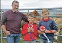  ?? 16_T32_Bunessansh­ow03 ?? John MacInnes with sons Cameron and Jamie from Iona with their champion cattle.