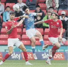  ?? ?? Posh sub Joel Randall in action at Barnsley. Photos: Joe Dent