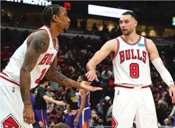  ?? AP ?? Nikola Vucevic is part of the Bulls’ ‘‘Big Three,’’ which includes DeMar DeRozan (left) and Zach LaVine.