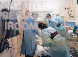  ?? JAE C. HONG/AP ?? While warnings were issued against traveling during the holidays due to the pandemic, which has killed more than 325,000 in the U.S., some are choosing to ignore those guidelines. Above, a coronaviru­s patient receives treatment in a Los Angeles hospital.