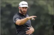  ?? NG HAN GUAN — THE ASSOCIATED PRESS ?? Dustin Johnson of United States gestures in the final round of the 2017 WGC-HSBC Champions golf tournament held at the Sheshan Internatio­nal Golf Club in Shanghai, China, Sunday. Johnson, the world’s No. 1 player going for his third World Golf...