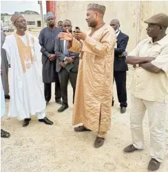  ??  ?? MD/CE of Jaiz Bank, Hassan Usman (2nd left in white outfit), listening to the Chairman of Tiamin Rice Ltd, Alhaji Aminu Ahmed (2nd from right), during a facility tour of the new Tiamin Rice Mill in Bauchi State recently.
