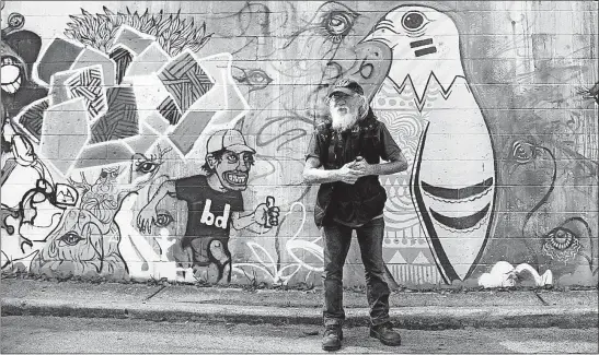  ?? [KYLE ROBERTSON/DISPATCH] ?? Panhandler Daniel Holcomb, 58, stands in a parking lot off North High Street in the Short North. Betsy Pandora, executive director of the Short North Alliance, said panhandlin­g incidents reported to the alliance in the first half of this year were 30...