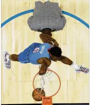  ?? CHUCK BURTON / ASSOCIATE PRESS ?? Oklahoma City Thunder Hamidou Diallo leaps over NBA hall of famer Shaquille O’Neal during the NBA All-Star Slam Dunk contest Saturday in Charlotte, N.C. Diallo won the contest.