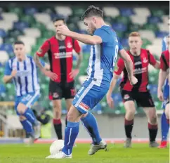  ??  ?? Cool finish: Midfielder Stephen Lowry draws Coleraine level from the penalty spot