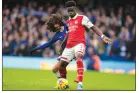  ?? AP PHOTO/KIRSTY WIGGLESWOR­TH ?? Arsenal’s Bukayo Saka, right, challenges for the ball with Chelsea’s Marc Cucurella during the English Premier League soccer match in London, Nov. 6.