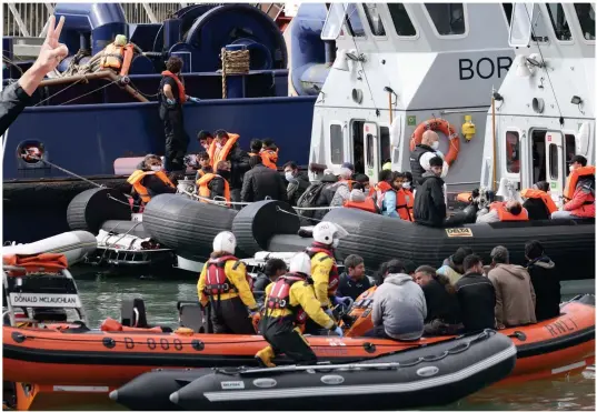  ??  ?? Flotilla of woe: Border Forces around Dover were inundated with a record number of migrants reaching the UK yesterday