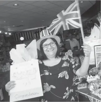  ?? Christina Ryan/calgary Herald ?? The British Pantry owner Hamida Virji says she’s excited about the birth of the royal baby — and expects business to pick up rapidly in her northwest Calgary shop.