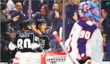  ?? QUINTON BYFIELD Gary A. Vasquez NHLI ?? celebrates his highlight-reel goal with Pierre-Luc Dubois and other teammates during the Kings’ 5-1 win over Columbus on Tuesday. Byfield has come on strong, and Dubois had a two-goal game.