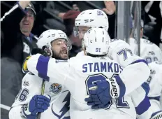  ?? THE ASSOCIATED PRESS FILES ?? Tampa Bay’s Nikita Kucherov, left, celebrates a goal with Victor Hedman, right, and Steven Stamkos during a game last month. The trio, along with goalie Nikita Kucherov, will represent the Lightning in the NHL All-Star Game.