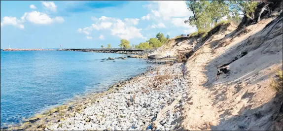  ?? CAROLE CARLSON/POST-TRIBNE ?? This photo from Oct. 9 shows the path above the rocks that beachgoers take at Portage Lakefront and Riverwalk Park. The National Park Service announced Thursday it closed the pathway after erosion washed it away.