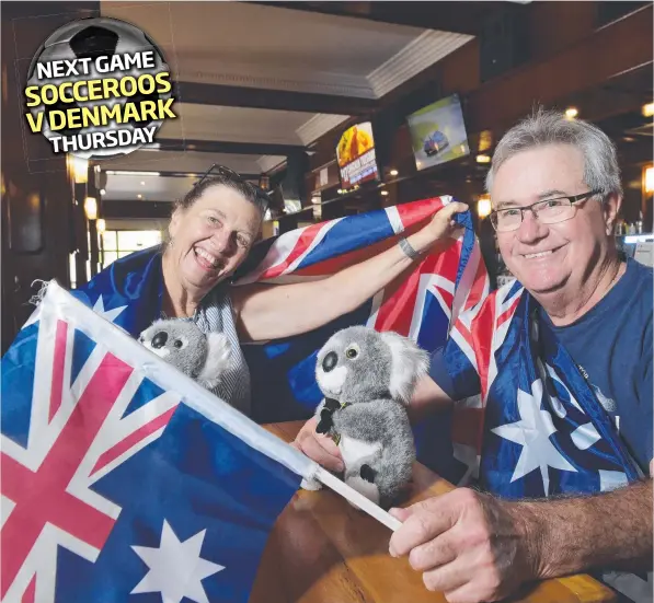  ?? Picture: KERI MEGELUS ?? Soccer fans Gail and Neville Mayberry joined packed crowds at Hotel Darwin to watch the Aussies take on France last night