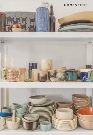  ??  ?? Kitchen detailJuli­a has created storage space in every available nook and cranny.This shelving provides a home for the couple’s eclectic mix of rustic ceramics. Get the look Try Such &amp; Such for similar tableware.