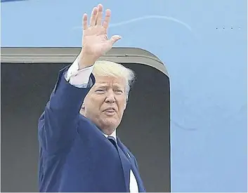  ?? MINH HOANG/THE ASSOCIATED PRESS ?? U.S. President Donald Trump waves goodbye before departing from Noi Bai internatio­nal airport in Hanoi, Vietnam on Sunday.