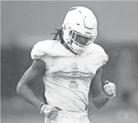  ?? CAITIE ?? Wide receiver Marquez Callaway runs on the field during practice in March.