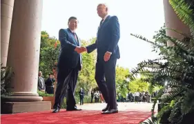  ?? DOUG MILLS/THE NEW YORK TIMES VIA AP, POOL ?? President Joe Biden greets Chinese President President Xi Jinping on Wednesday in Woodside, Calif.