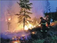  ??  ?? Firefighte­rs battle a forest blaze in the Hanma National Nature Reserve in the Inner Mongolia autonomous region on Monday.