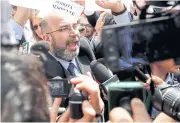  ?? REUTERS ?? Vito Crimi, the 5-Star Movement’s caretaker leader, talks with the media in front of Italy’s parliament.