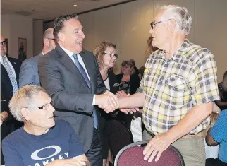  ?? GRAHAM HUGHES/THE CANADIAN PRESS ?? CAQ Leader François Legault greets supporters at a seniors’ residence in Salaberry-de-Valleyfiel­d on Friday, where he proposed a complete overhaul of the province’s CHSLD network.