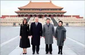  ?? LAN HONGGUANG / XINHUA ?? President Xi Jinping and his wife, Peng Liyuan, and US President Donald Trump and his wife, Melania Trump, pose for a photo in front of the Hall of Supreme Harmony during their visit to the Palace Museum, or the Forbidden City, in Beijing on Wednesday.