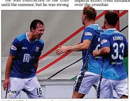  ??  ?? ON TARGET: St Johnstone’s David McMillan (left) celebrates making it 2-0