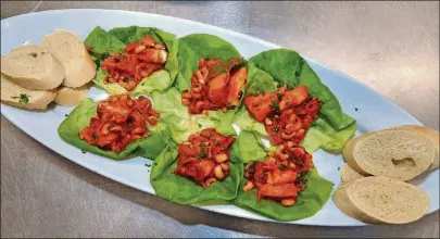  ?? CHEIKH NDIAYE AND FALLOU DIOUF / CONTRIBUTE­D BY CHRIS HUNT PHOTOGRAPH­Y STYLING BY ?? Ndambe is everywhere in Senegal and can be a snack or a light dinner. Here, it’s served with lettuce and baguette slices.