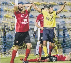  ??  ?? RESULT Christian Burgess celebrates after scoring for new club Royale Union Saint-Gilloise