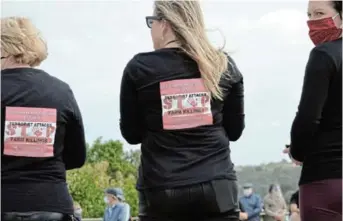  ?? Picture: JON HOUZET ?? SHIRTS WITH A MESSAGE: Some participan­ts in the Move One Million protest in Port Alfred last Saturday had shirts branded specially for the occasion
’