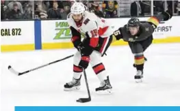  ??  ?? LAS VEGAS: Zack Smith (L) #15 of the Ottawa Senators skates with the puck against Jon Merrill #15 of the Vegas Golden Knights in the third period of their game at TMobile Arena on Friday in Las Vegas, Nevada. The Senators won 5-4.— AFP