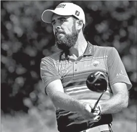  ?? KEVIN C. COX/GETTY ?? Troy Merritt tied a course record with a 62 at rain-softened Liberty National on Thursday.