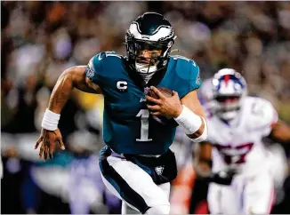  ?? MATT ROURKE/ASSOCIATED PRESS ?? Eagles quarterbac­k Jalen Hurts went 14-1 in his regular-season starts and had 3,701 yards passing, 760 yards rushing and 35 touchdowns (22 passing, 13 rushing).