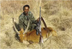  ??  ?? Guide Johannes with the lechwe shot by the author with the Musgrave.