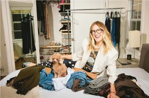  ?? MAGGIE SHANNON/THE NEW YORK TIMES PHOTOS ?? Stylist Chellie Carlson, seen Jan. 18 at her Los Angeles home, helps her clients edit their wardrobes down.