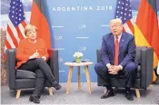  ?? PABLO MARTINEZ MONSIVAIS/ASSOCIATED PRESS ?? U.S. President Donald Trump, right, speaks during his meeting with Germany’s Chancellor Angela Merkel, left, Saturday in Buenos Aires, Argentina.