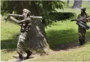  ?? — PTI ?? Army personnel in action during an encounter with militants near the Line of Control in the Tangdhar area of Kupwara district, Jammu and Kashmir, on Tuesday.