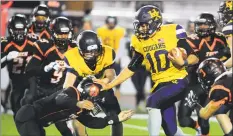  ?? Christian Abraham / Hearst Connecticu­t Media ?? Haddam-Killingwor­th’s Tobey Callender stiff-arms a defender during the Class S quarterfin­als against Bullard Havens.