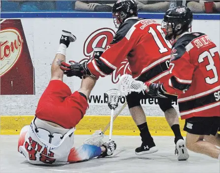  ?? CLIFFORD SKARSTEDT EXAMINER ?? Peterborou­gh Century 21 Lakers’ Shawn Evans is levelled by Brooklin Redmen’s Chris Corbeil during first period action in Game 6 of their Major Series Lacrosse semifinal series Wednesday night at the Iroquois Park Arena in Whitby.