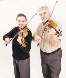  ??  ?? J.J. Guy, left, and Gordon Stobbe — a.k.a. Twin Fiddles — are set to entertain an audience at The Bassment on Tuesday.