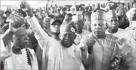  ?? (REUTERS/Marvellous Durowaiye) ?? Bola Ahmed Tinubu reacts after he was declared winner in Nigeria’s presidenti­al election at the Party’s campaign headquarte­rs, in Abuja.