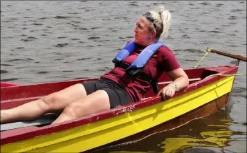  ??  ?? Ferrycarri­g Rowing Club cox Lorraine Foley getting a well earned rest at the Killurin Regatta.