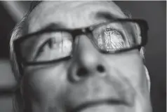  ?? Associated Press ?? Wayne Christophe­r stands for a portrait Sept. 25 in Port Arthur, Texas, as a stained glass window is reflected in his glasses in the damaged sanctuary of the Memorial Baptist Church he’d attended his whole life.