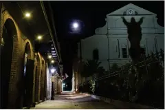  ?? GETTY IMAGES ?? A full moon rises over Pere Antoine Alley and St. Anthony's Garden behind St. Louis Cathedral in New Orleans' French Quarter. Prepare to be spooked.