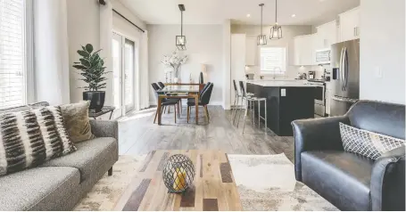  ??  ?? Large triple-clear windows let natural light flood into the open-concept main floor in The Camden by North Ridge Developmen­t Corporatio­n. PHOTOS: SCOTT PROKOP PHOTOGRAPH­Y