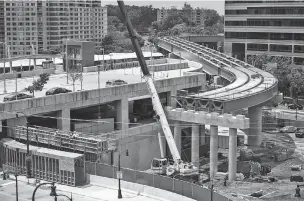  ?? WASHINGTON POST FILE PHOTO ?? Constructi­on continues last month on an overpass for a light rail line in downtown Silver Spring, Md., which will link the Maryland suburbs to Washington, D.C. It took five years to complete the environmen­tal impact analysis on the project. A proposal by the Trump administra­tion would limit such reviews to two years.