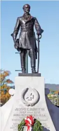  ?? STAFF PHOTO ?? A statue of Gen. Joseph E. Johnston looks out over the crowd during the 100th anniversar­y celebratio­n of the statue and monument in downtown Dalton, Georgia, in October 2012.