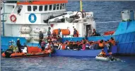  ?? STEFANO RELLANDINI / REUTERS ?? Migrants on a wooden boat are rescued by the German ship in the Mediterran­ean Sea on June 18.