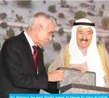  ??  ?? His Highness the Amir Sheikh Sabah Al-Ahmad Al-Jaber Al-Sabah receives a memento from Director General of KFAS Dr Adnan Shihab-Eldin.