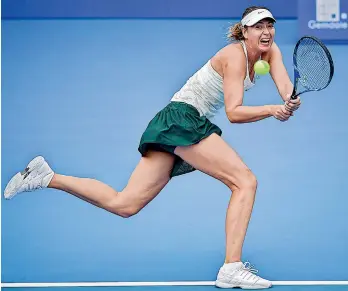  ?? AFP ?? Maria Sharapova of Russia hits a return against Mihaela Buzarnescu of Romania at the Shenzhen Open tennis tournament in Shenzhen, in China’s southern Guangdong province on Monday. Sharapova won 6-3, 6-0. —