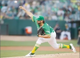  ??  ?? Oakland Athletics pitcher Tanner Roark works against the Houston Astros during the first inning of a baseball game
on Aug 16 in Oakland, California. (AP)